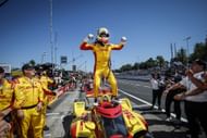 Alex Palou celebrates atop his car after winning the 2025 IndyCar title in Portland - Source: Getty
